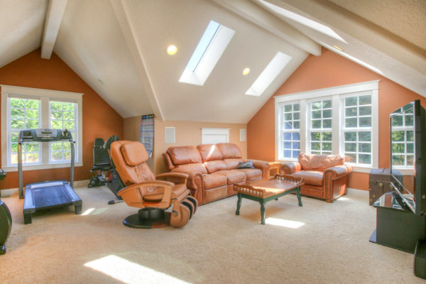 living room and gym design - custom built Oregon home